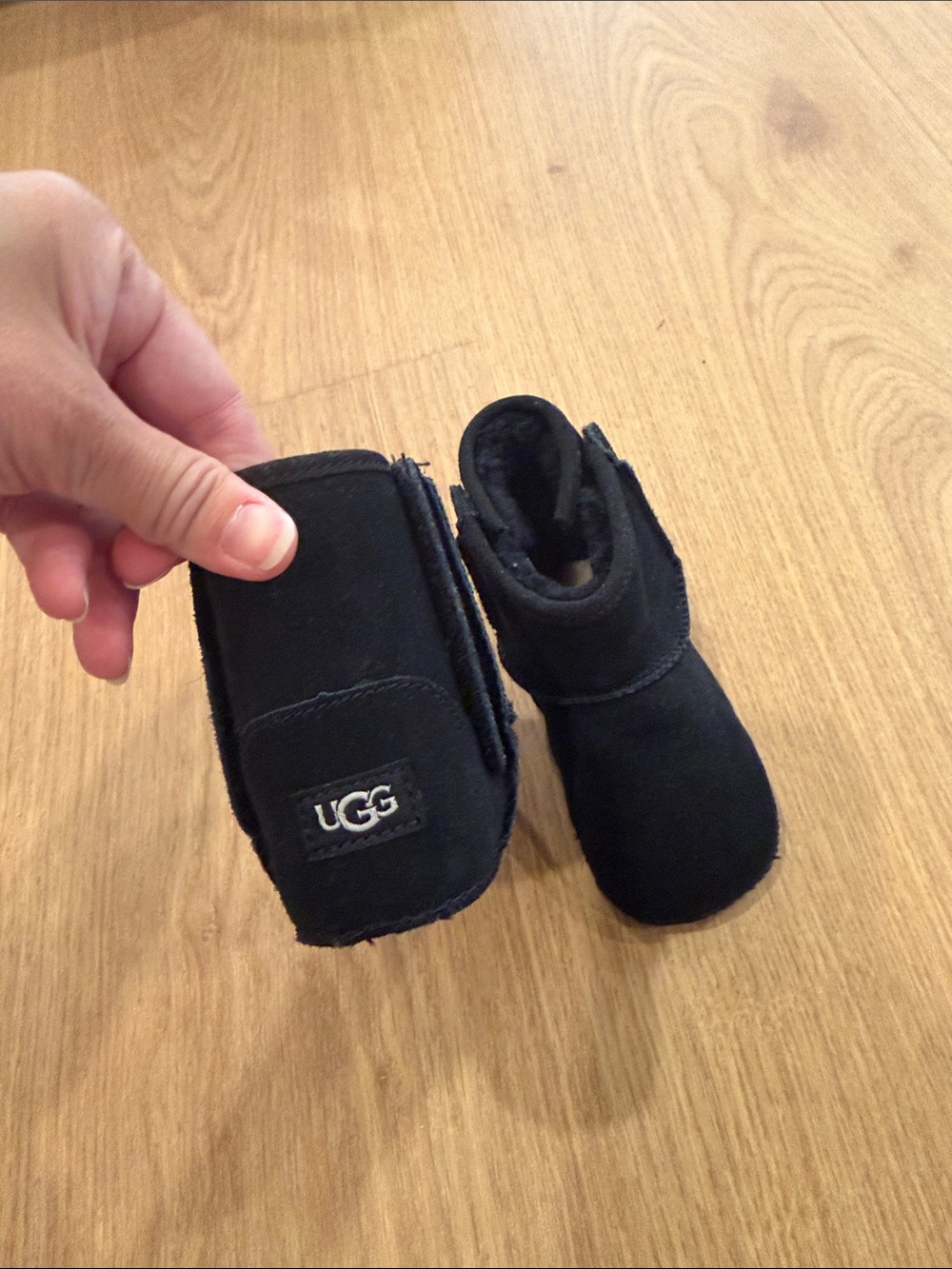 Kids black UGG booties